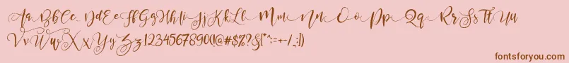 Шрифт ValledofasJustPersonalOnly – коричневые шрифты на розовом фоне