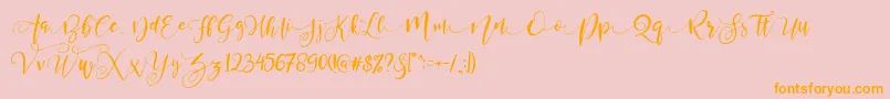 ValledofasJustPersonalOnly-Schriftart – Orangefarbene Schriften auf rosa Hintergrund