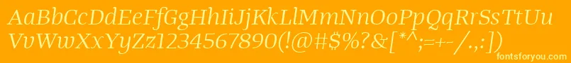 Czcionka TangerserifwideBookitalic – żółte czcionki na pomarańczowym tle