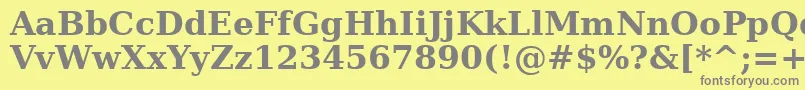 Verasebd-fontti – harmaat kirjasimet keltaisella taustalla