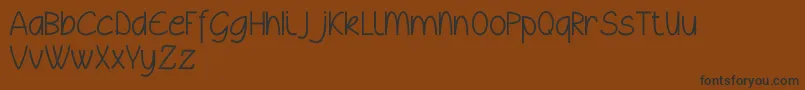 Wyllamdemo Font – Black Fonts on Brown Background