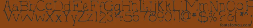 fuente DjbHollyTyped2Much – Fuentes Negras Sobre Fondo Marrón