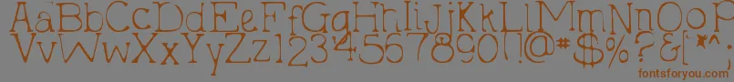 DjbHollyTyped2Much-Schriftart – Braune Schriften auf grauem Hintergrund
