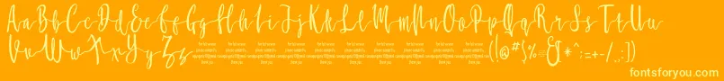 フォントMollucaFree – オレンジの背景に黄色の文字