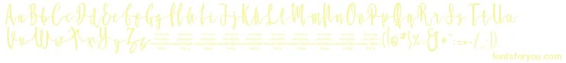 Czcionka MollucaFree – żółte czcionki na białym tle