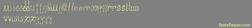 Assperiments Font – Yellow Fonts on Gray Background