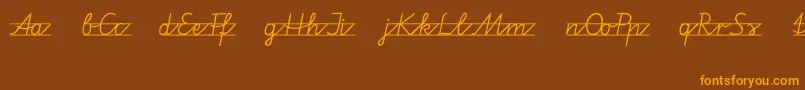 フォントVamiba – オレンジ色の文字が茶色の背景にあります。