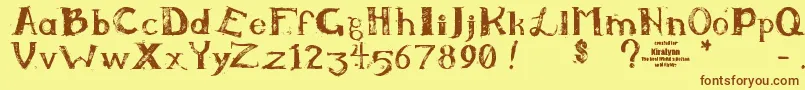 フォントKiralynn – 茶色の文字が黄色の背景にあります。