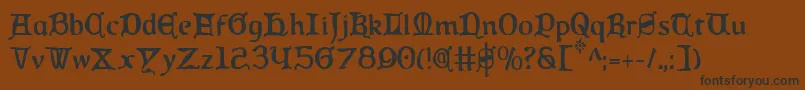 フォントQueenCountryCondensed – 黒い文字が茶色の背景にあります