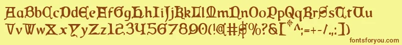 フォントQueenCountryCondensed – 茶色の文字が黄色の背景にあります。