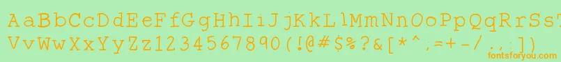 フォントTheantitype – オレンジの文字が緑の背景にあります。