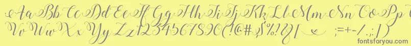 Шрифт StylishCalligraphyDemo – серые шрифты на жёлтом фоне