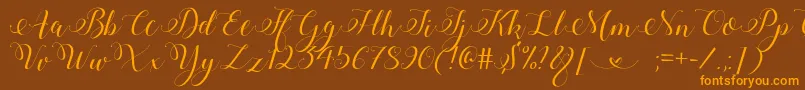StylishCalligraphyDemo-fontti – oranssit fontit ruskealla taustalla