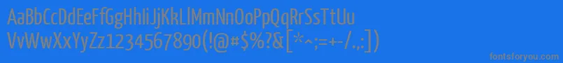 YanonekaffeesatzRegular-fontti – harmaat kirjasimet sinisellä taustalla