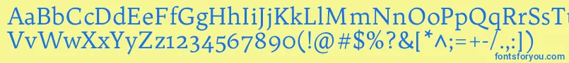 フォントTrykkerRegular – 青い文字が黄色の背景にあります。