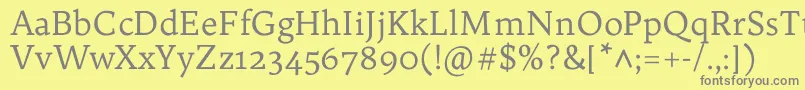 フォントTrykkerRegular – 黄色の背景に灰色の文字