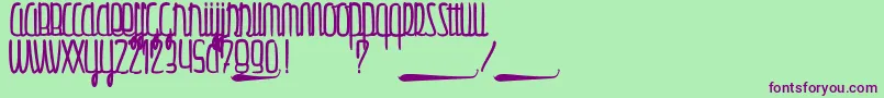 Gulliver Font – Purple Fonts on Green Background