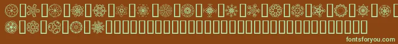 フォントJiKaleidoscopeBats5 – 緑色の文字が茶色の背景にあります。
