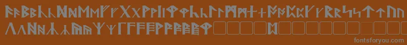 Britannian-Schriftart – Graue Schriften auf braunem Hintergrund