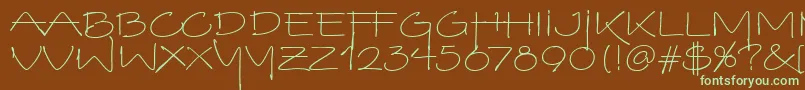 フォントVinoBiancoItc – 緑色の文字が茶色の背景にあります。