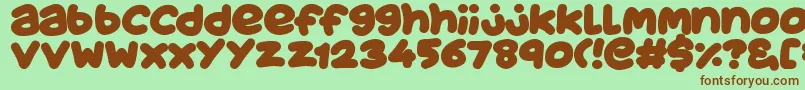 JuicyFruityPlain-Schriftart – Braune Schriften auf grünem Hintergrund