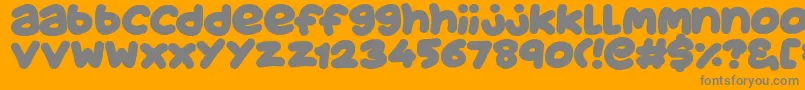 JuicyFruityPlain-fontti – harmaat kirjasimet oranssilla taustalla