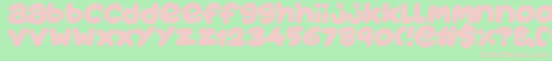 フォントJuicyFruityPlain – 緑の背景にピンクのフォント