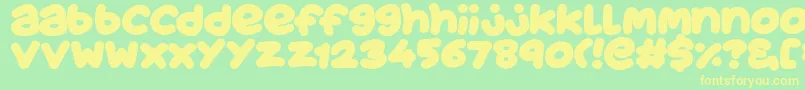 フォントJuicyFruityPlain – 黄色の文字が緑の背景にあります