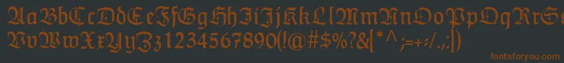 HumboldtfrakturZierbuchstaben-Schriftart – Braune Schriften auf schwarzem Hintergrund
