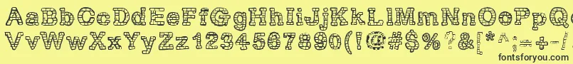 RhBrickhausProtoVertebra Font – Black Fonts on Yellow Background