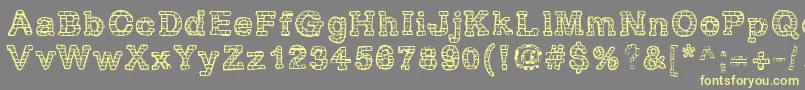 RhBrickhausProtoVertebra Font – Yellow Fonts on Gray Background