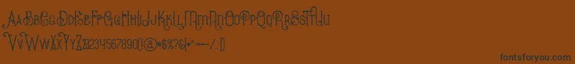 BurenoRegular Font – Black Fonts on Brown Background