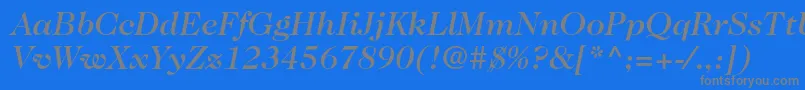 Fonte Caslon224stdMediumitalic – fontes cinzas em um fundo azul