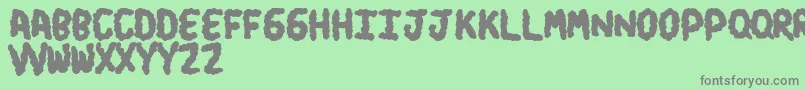 Turds Font – Gray Fonts on Green Background