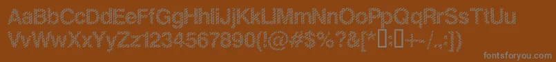 SlangKing-fontti – harmaat kirjasimet ruskealla taustalla