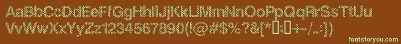 フォントSlangKing – 緑色の文字が茶色の背景にあります。