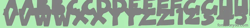 SolidCartoonlings Font – Gray Fonts on Green Background