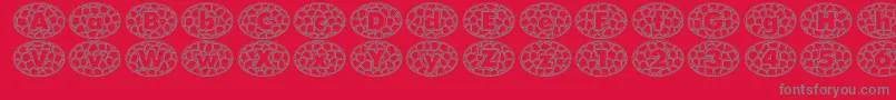 QuintusStainedcameo-Schriftart – Graue Schriften auf rotem Hintergrund