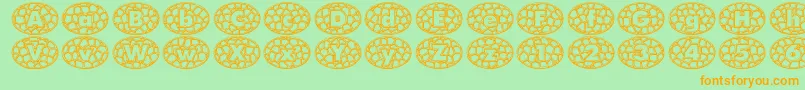 QuintusStainedcameo-fontti – oranssit fontit vihreällä taustalla