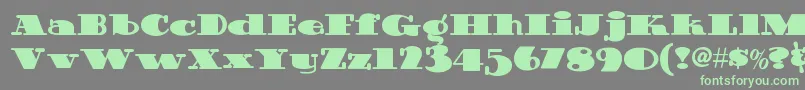 Fonte Guinnessextrastoutnf – fontes verdes em um fundo cinza