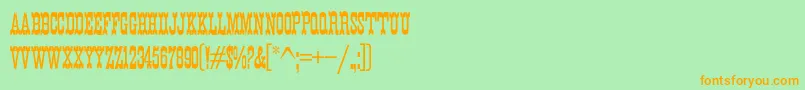 K22EurekaNofrills Font – Orange Fonts on Green Background