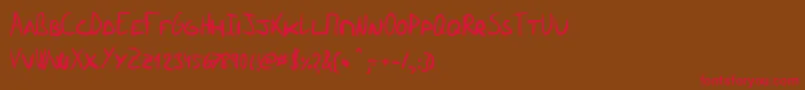 フォントRamonecesCaps – 赤い文字が茶色の背景にあります。
