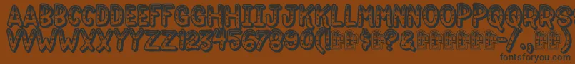 Jokewood-Schriftart – Schwarze Schriften auf braunem Hintergrund