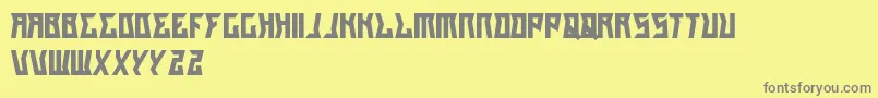 GilangCintaSabrina-fontti – harmaat kirjasimet keltaisella taustalla