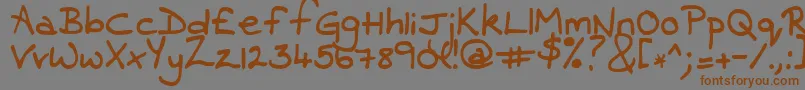 フォントContrarymary – 茶色の文字が灰色の背景にあります。