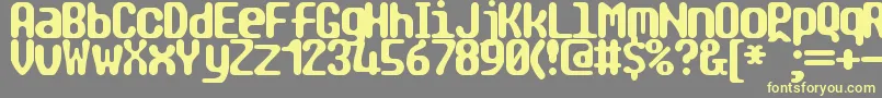 TragicBrk Font – Yellow Fonts on Gray Background
