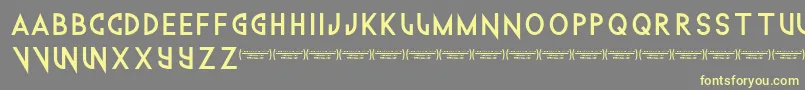 Technowanker Font – Yellow Fonts on Gray Background