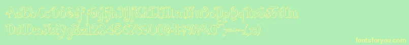 フォントQuillswordout – 黄色の文字が緑の背景にあります