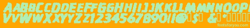 StinkfistySmallCaps-Schriftart – Grüne Schriften auf orangefarbenem Hintergrund