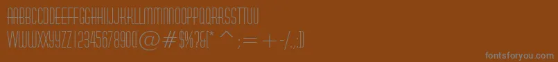 Czcionka HuxleyVerticalBt – szare czcionki na brązowym tle